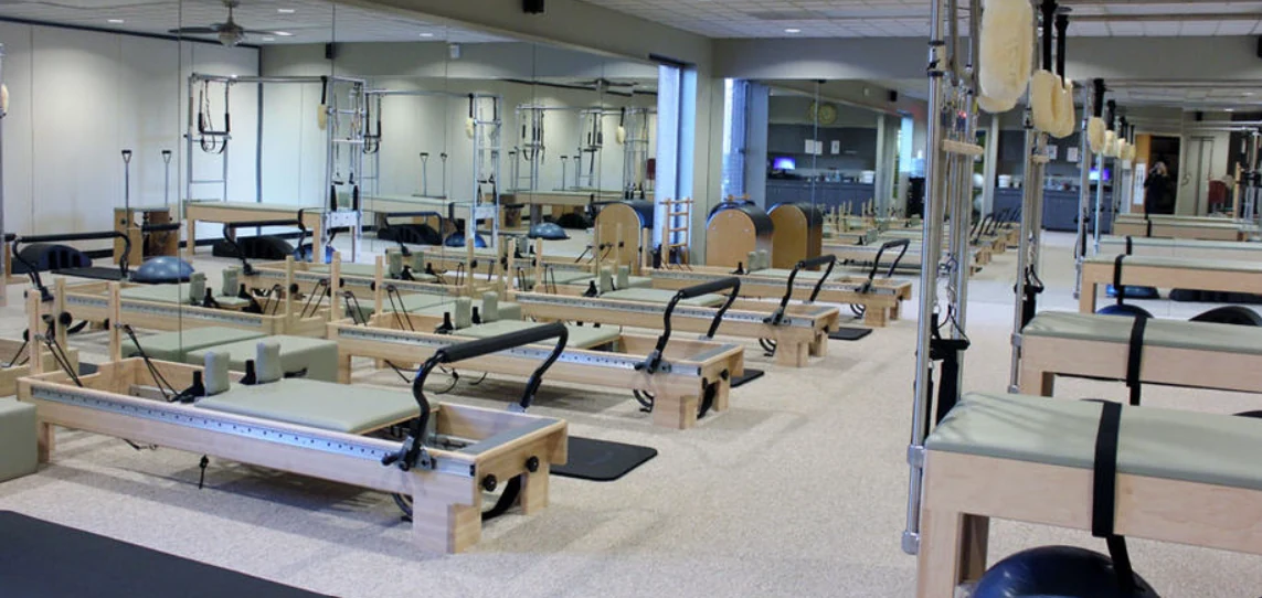 Reformers and Pilates equipment arranged throughout the Overland Park studio