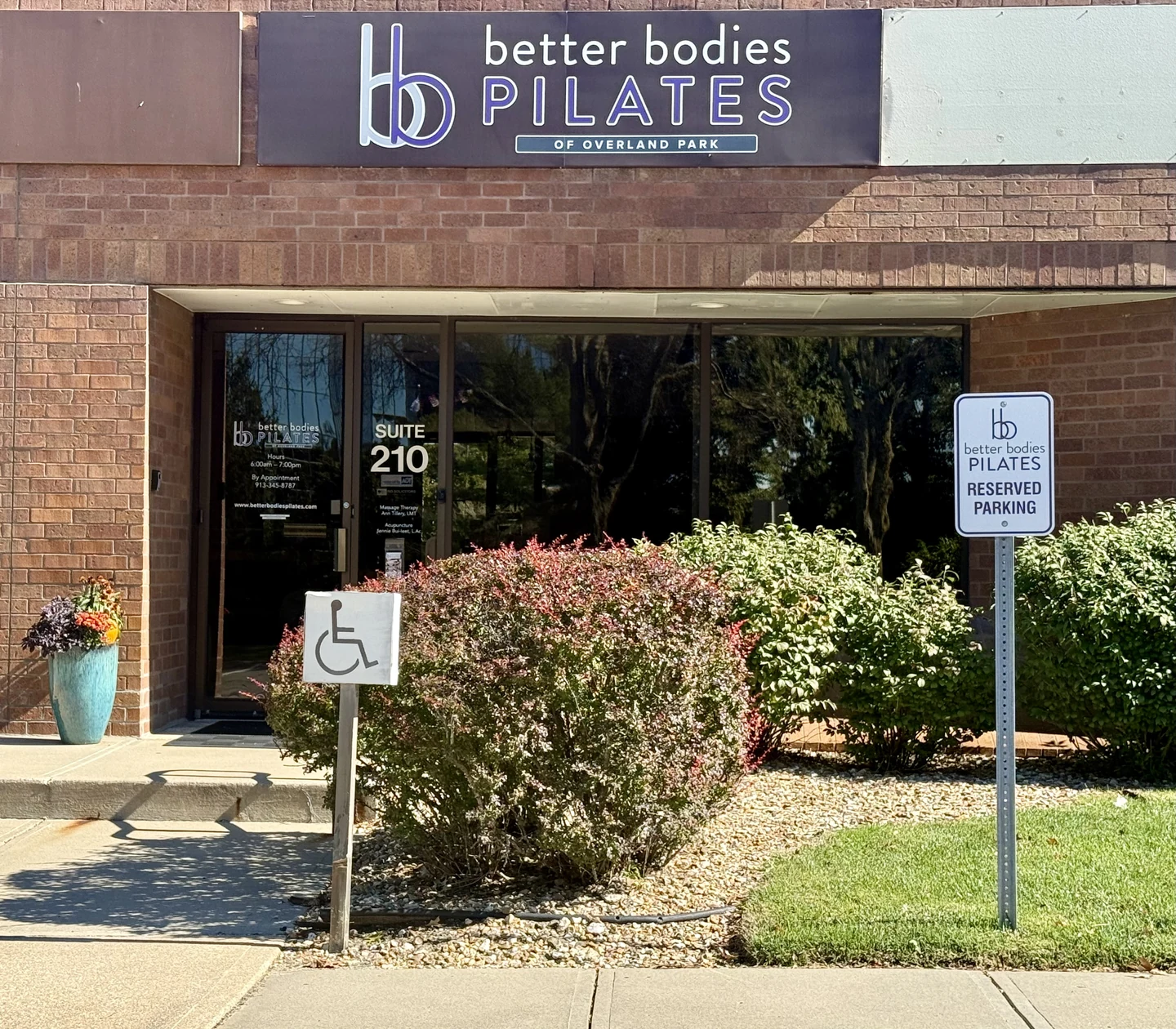 The Better Bodies Pilates storefront and Suite 210 entrance in Overland Park